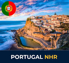 Scenic coastal village with white buildings perched on cliffs overlooking the ocean, the Portuguese flag in the top corner, and the text "Portugal NHR" below.